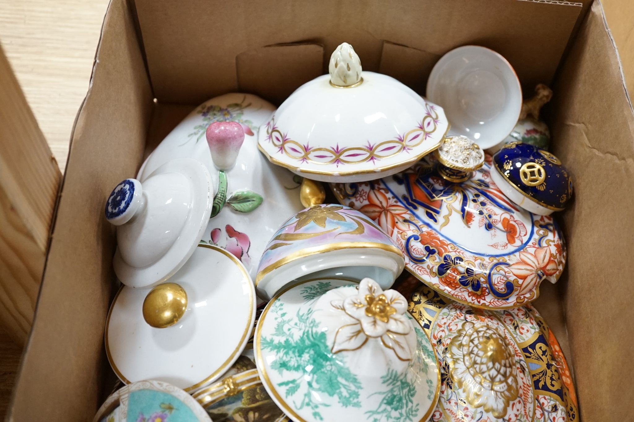 A mixed collection of porcelain covers